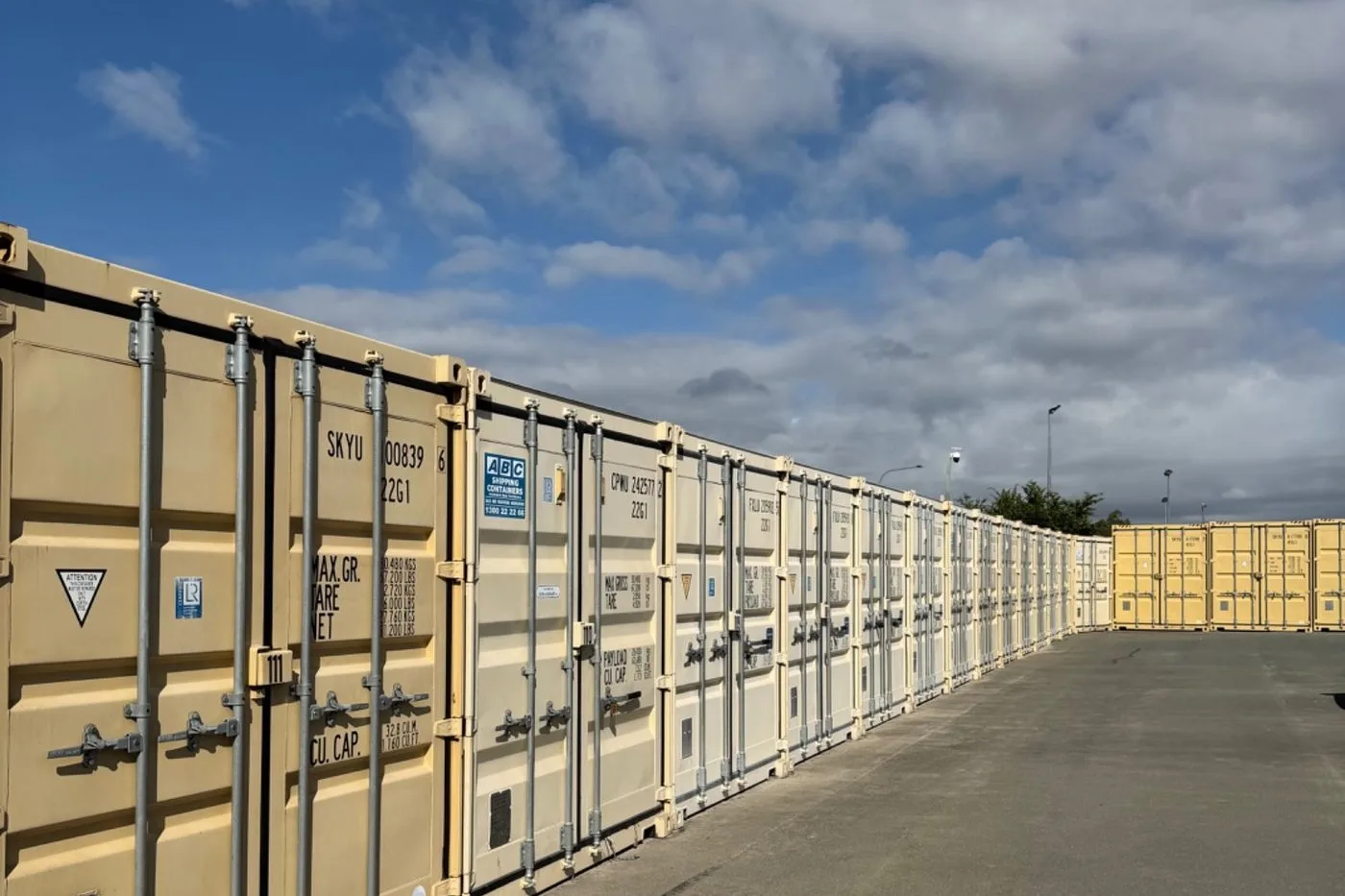 Rows of 20ft container storage units on the sealed bitumen yard at Storage Land, Archerfield Brisbane