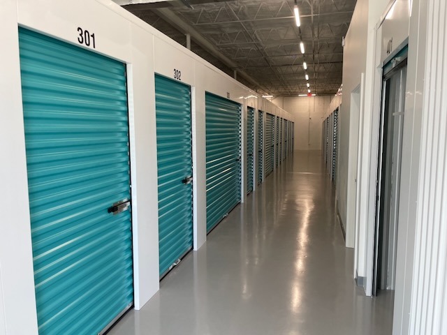 A hallway with roll-up doors on each side